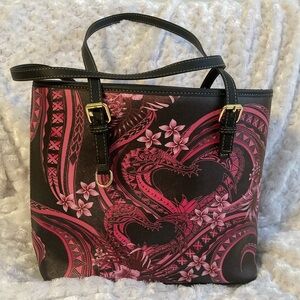 Tribal print bag with hearts and flowers. Gold hardware. Adjustable straps.